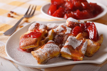 Austrian Kaiserschmarrn with plum sauce close-up. horizontal
