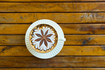 cup of coffee latte on the wooden desk