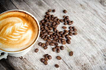 cup of coffee latte on the wooden desk