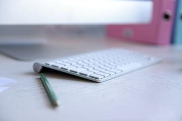 Wireless keyboard and mouse on the table, close up