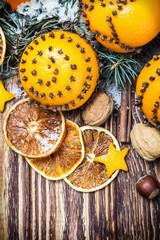 dried oranges with nuts and fir branches