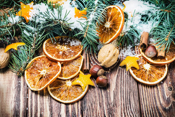 dried oranges with nuts and fir branches