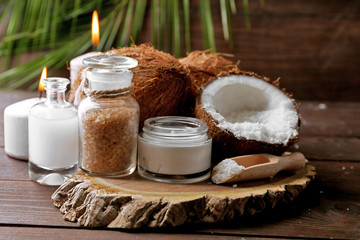 Obraz na płótnie Canvas Spa coconut products on dark wooden background
