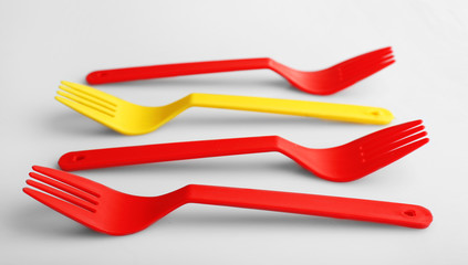 Disposable colourful forks isolated on white, Individuality concept