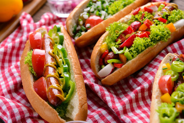 Hot dogs and vegetables on napkin closeup
