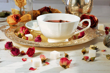 Hot rose tea on metal tray