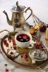 Fototapeta premium Hot rose tea on metal tray