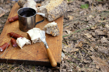 Grilled sausages on cutting board in the wood