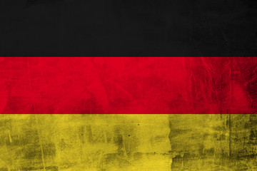 grunge flag of germany on concrete wall