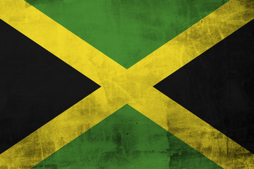 Grunge Flag of Jamaica on concrete wall