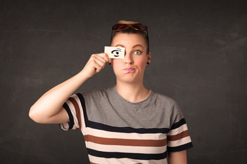 Silly youngster looking with hand drawn eye paper