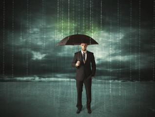 Business man standing with umbrella data protection concept