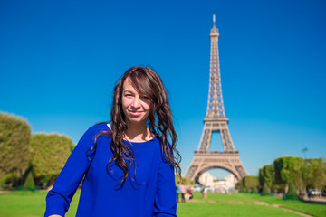 Portrait of beautiful woman in Paris background the Eiffel tower