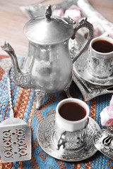 Antique tea-set with Turkish delight on table close-up