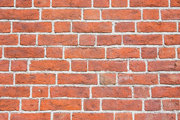 Grunge red brick wall texture.