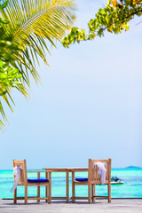 Summer empty outdoor cafe on exotic shore