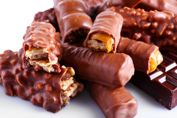 Mix of chocolate bars on table, close-up