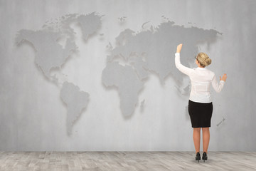 Business woman draw a map on the wall, a global business
