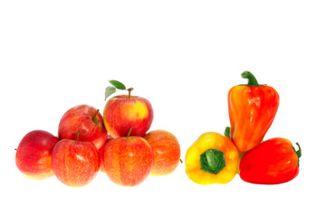 Red ripe apples and sweet pepper on a white background