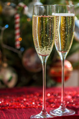Two Champagne Flutes on Christmas Background