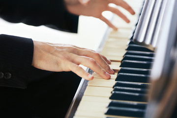 Obraz premium Close up of man hands piano playing