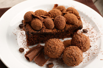 A piece of chocolate cake balls on the table, close-up