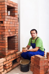 Man building a masonry heater