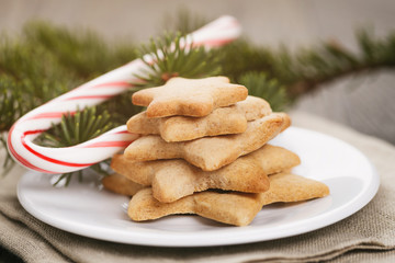 star cookies and candy cane on table
