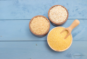 millet and buckwheat groats, rice on the blue board