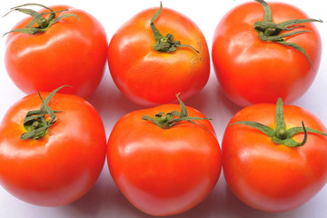red tomatoes background. Group of tomatoes