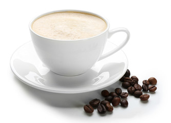 A cup of tasty drink and scattered coffee grains, isolated on white