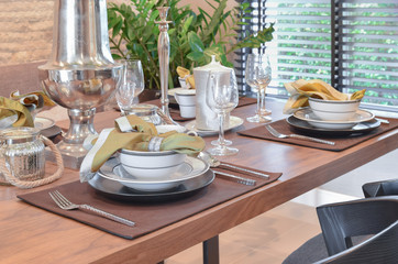elegant table set in modern style dining room interior