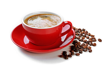A red cup of tasty drink and scattered coffee grains, isolated on white