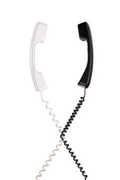 The black handset with a twisted wire, stretched horizontally