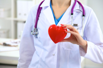 Close-up of unknown female doctor with stethoscope isolated