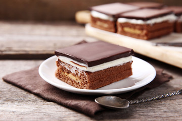 Delicious chocolate brownies on wooden background