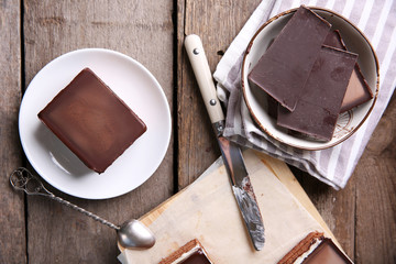 Delicious chocolate brownies on wooden background