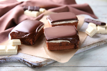 Delicious chocolate brownies on wooden background
