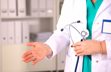 Portrait of happy medical doctor woman in office