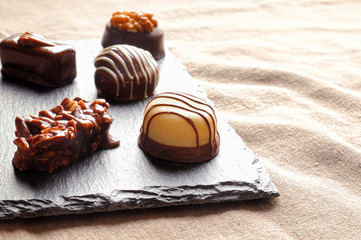 Assorted bonbons on a slate plate