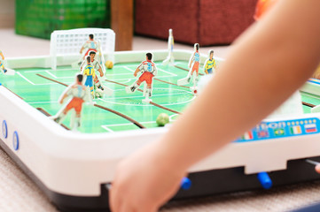 Child playing table football