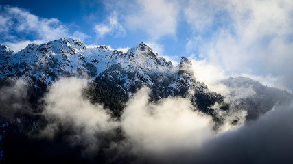 Fototapeta na wymiar snowy cloudy mountain landscape