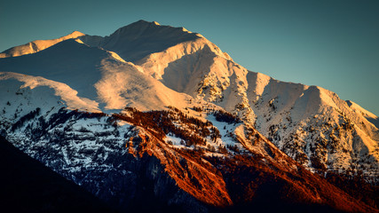 snowy mountain landscape at dawn 