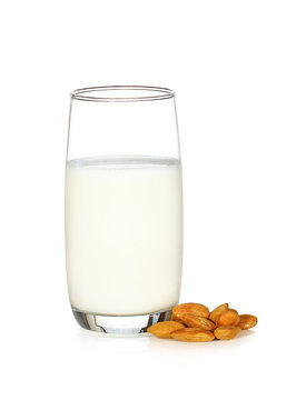 glass of milk and almond isolated on white background