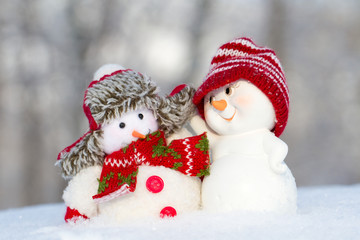 two small cheerful snowman