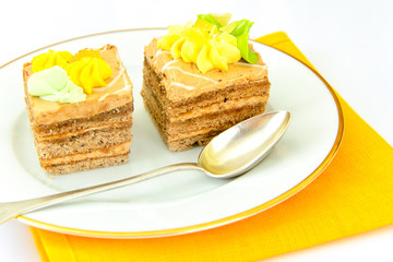 Sweets: Cream Cakes on Plate.