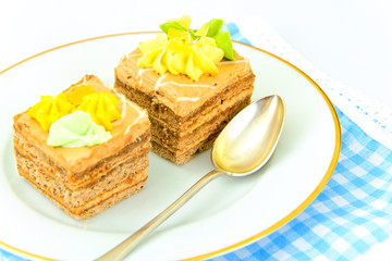 Sweets: Cream Cakes on Plate.
