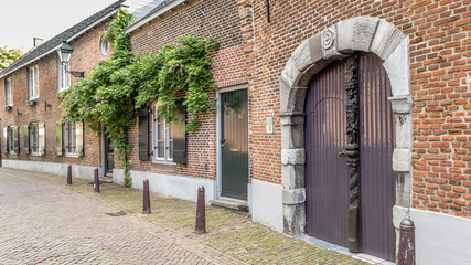 Old houses in the streets of  the city 's-Hertogenbosch in the Netherlands
