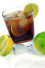 Cocktail with whisky, cola and fresh lime isolated on white background