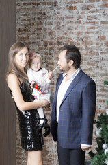 Family portrait near the Christmas tree. Christmas family portrait around the Christmas tree. 